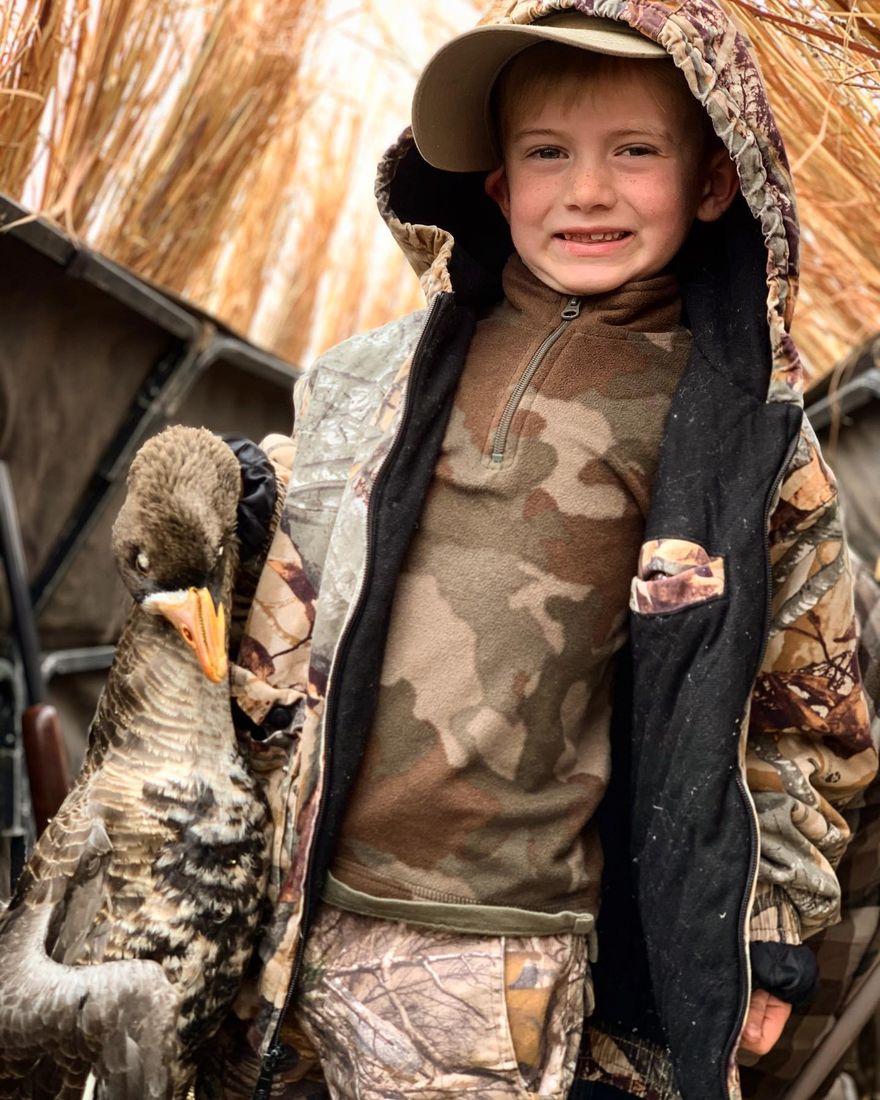 Young hunter with their first goose