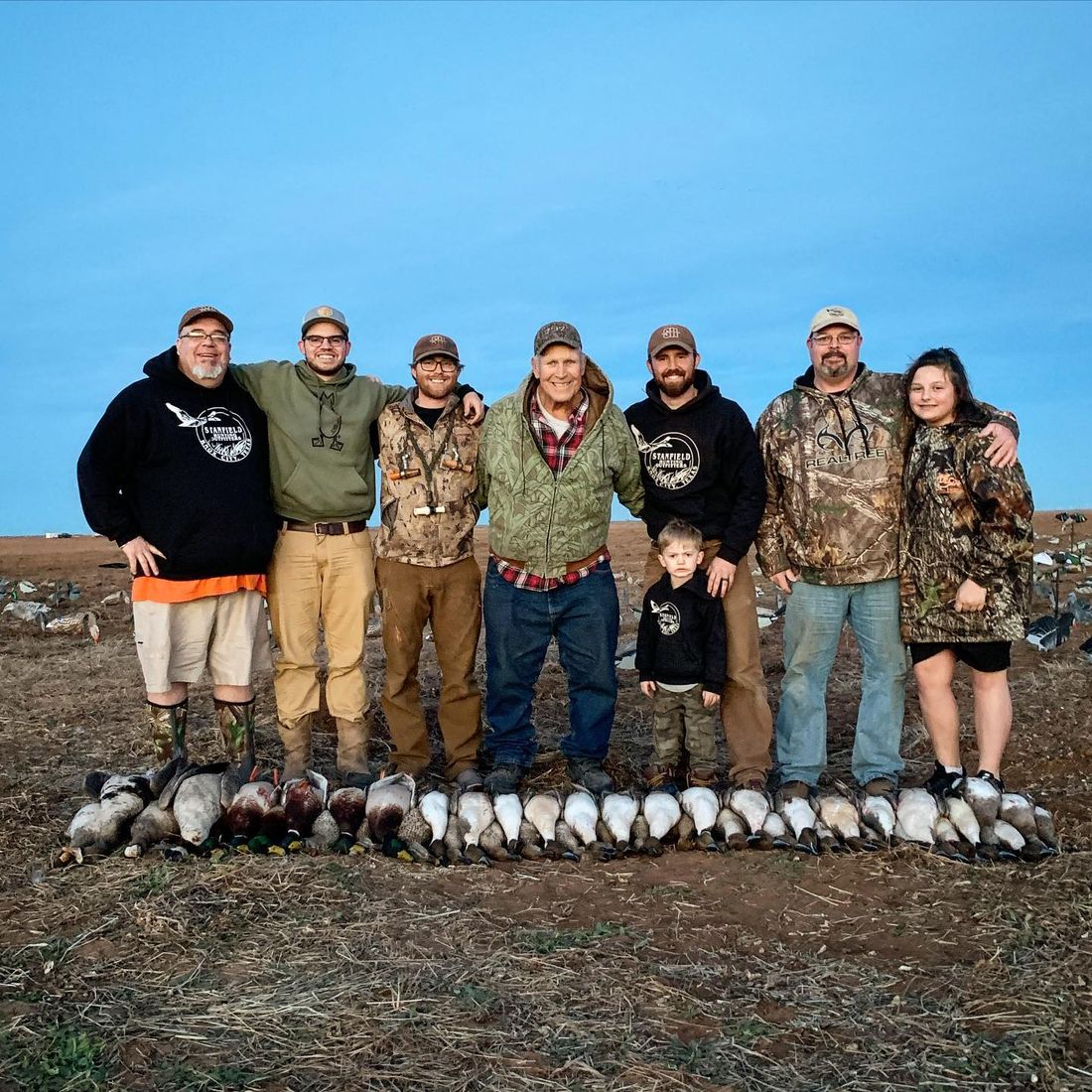 Big-group photo on the field after a hunt