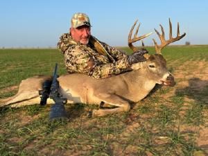 Hunter with a trophy whitetail buck
